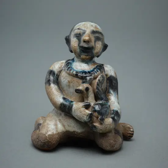 A Sawankhalok stoneware figure (tukatha),